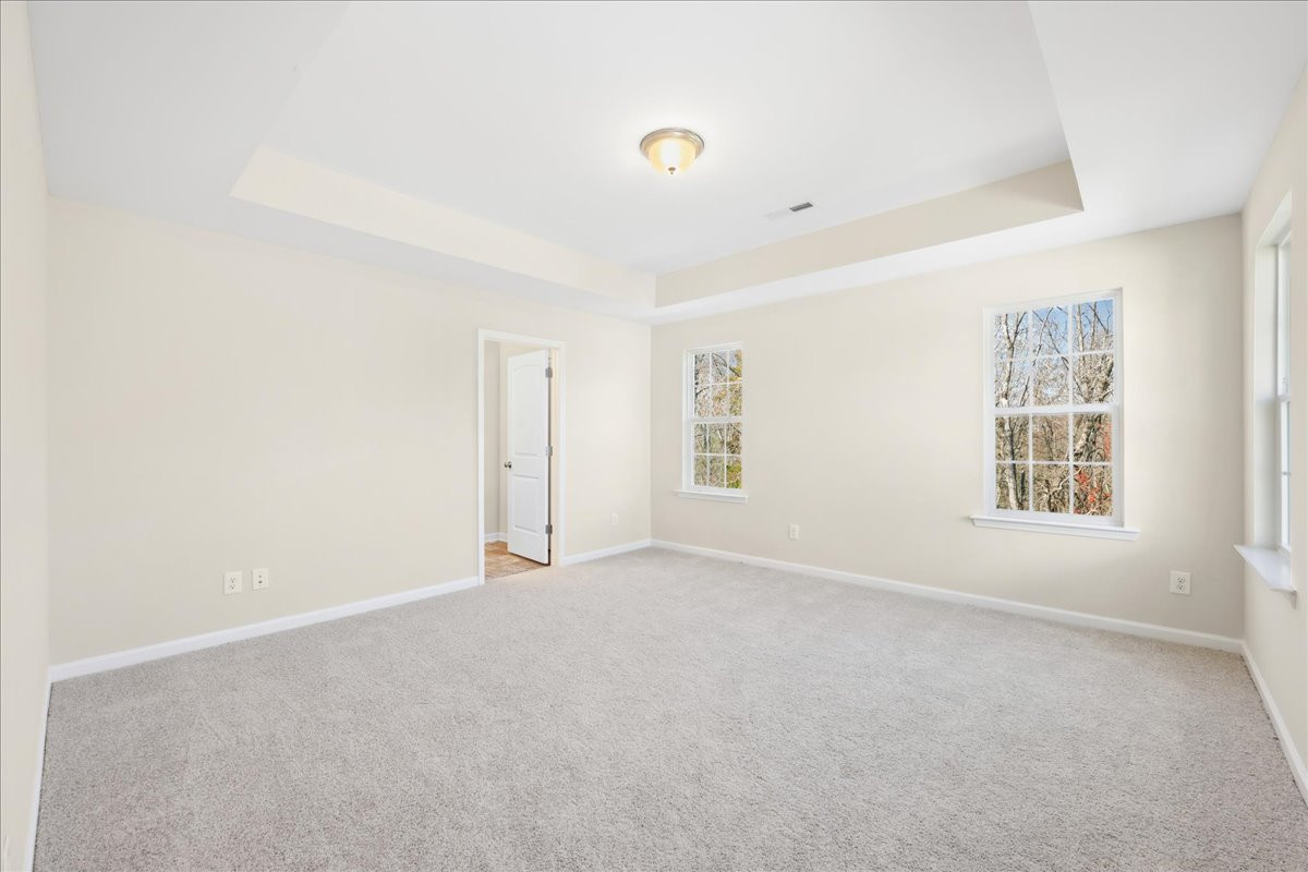 https://assets.windsorhomes.us/img/BCR_lot3_Cameron_elvC_1951_Kippen_Drive_primary_suite.jpg