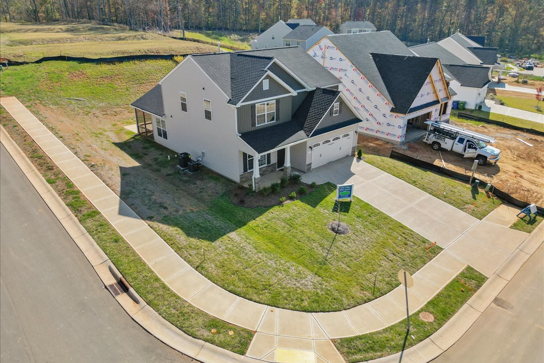 https://assets.windsorhomes.us/img/Bailey_B_VR_lot50_1703_Langlais_drive_Exterior_Drone.jpg