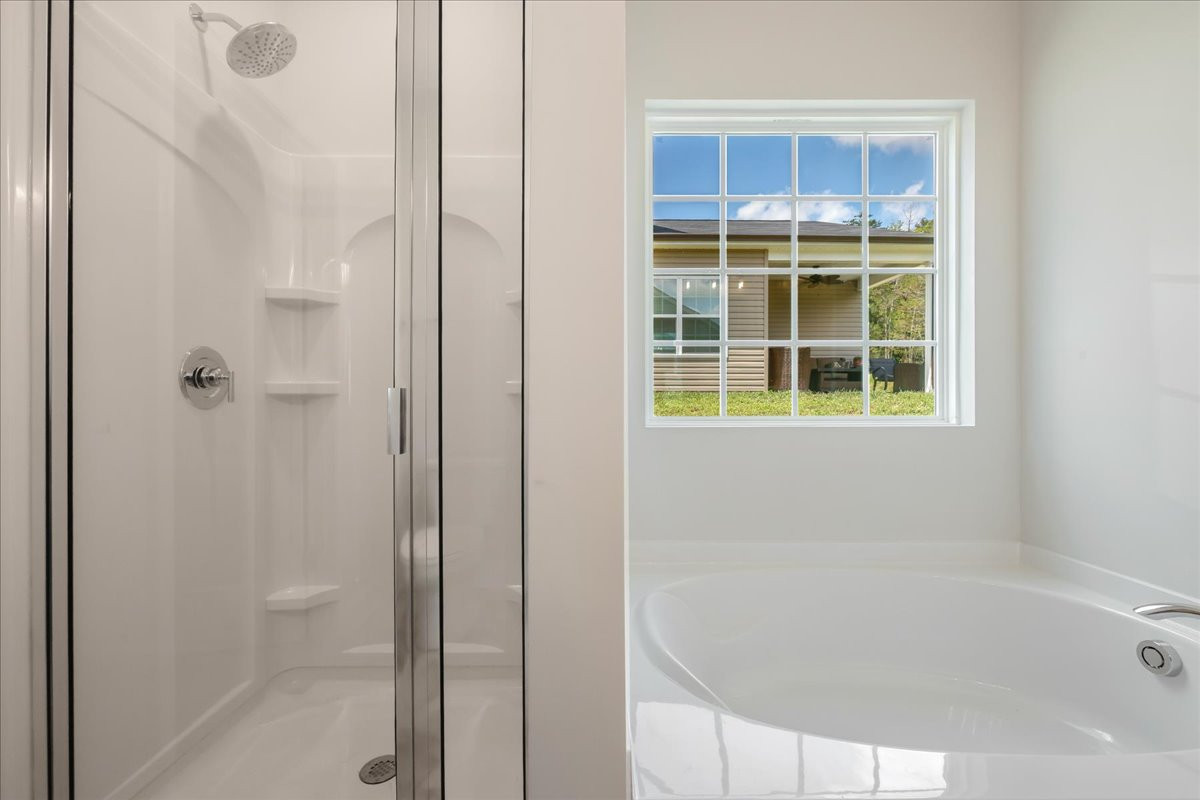 https://assets.windsorhomes.us/img/CCK_lot78_Somerset_elvD_4106_Stallion_Street_primary_bath_shower_tub_edit.jpg
