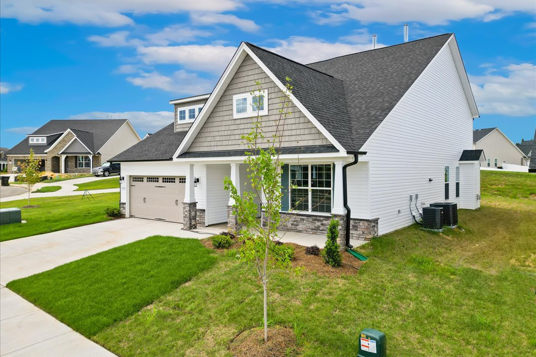 https://assets.windsorhomes.us/img/Cotswold_3_BD_lot42_2059_Dowell_Court_Exterior_Front_2.jpg