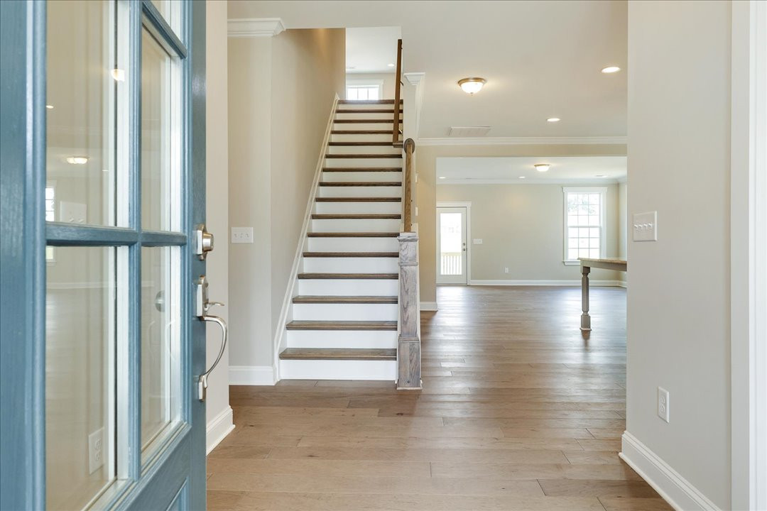 https://assets.windsorhomes.us/img/Cotswold_3_BD_lot42_2059_Dowell_Court_Foyer.jpg