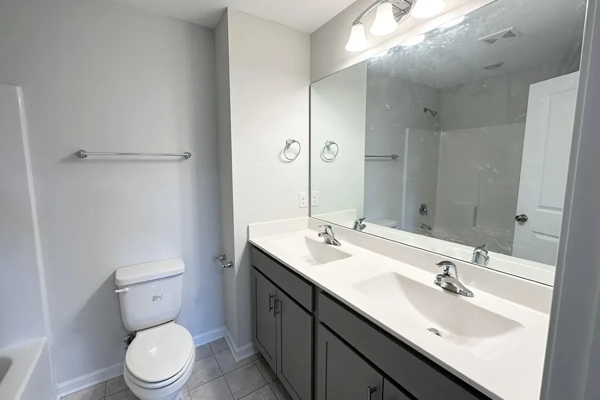 https://assets.windsorhomes.us/img/GRY_lot150_Cameron_B_7841_Waterwillow_Dr_bathroom.webp