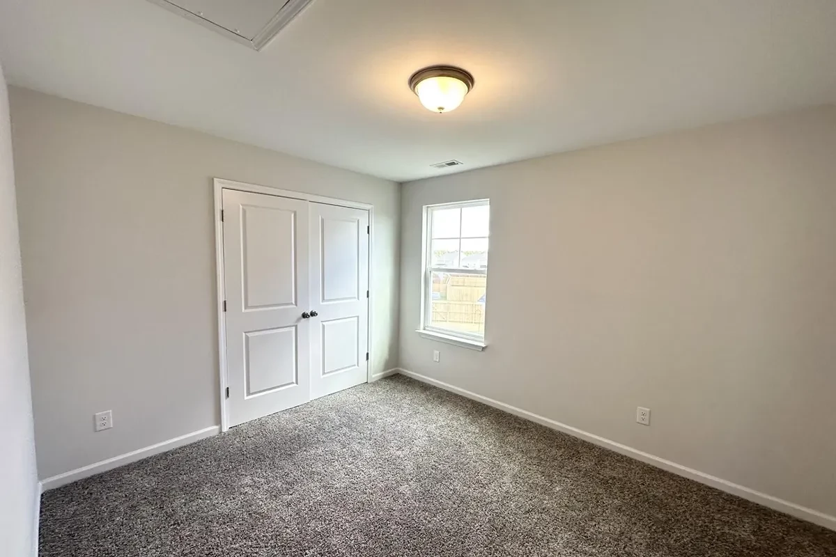 https://assets.windsorhomes.us/img/GRY_lot150_Cameron_B_7841_Waterwillow_Dr_bedroom_3.webp