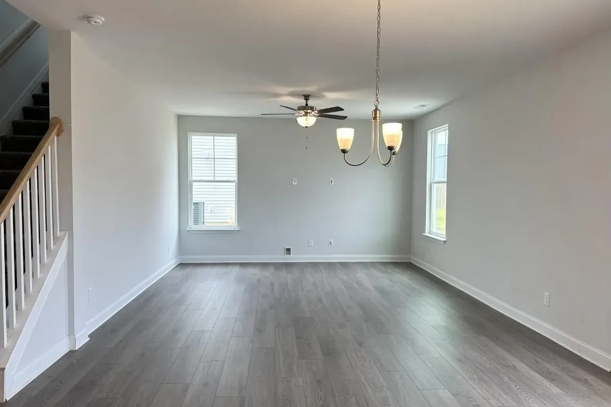 https://assets.windsorhomes.us/img/GRY_lot150_Cameron_B_7841_Waterwillow_Dr_living_room.webp