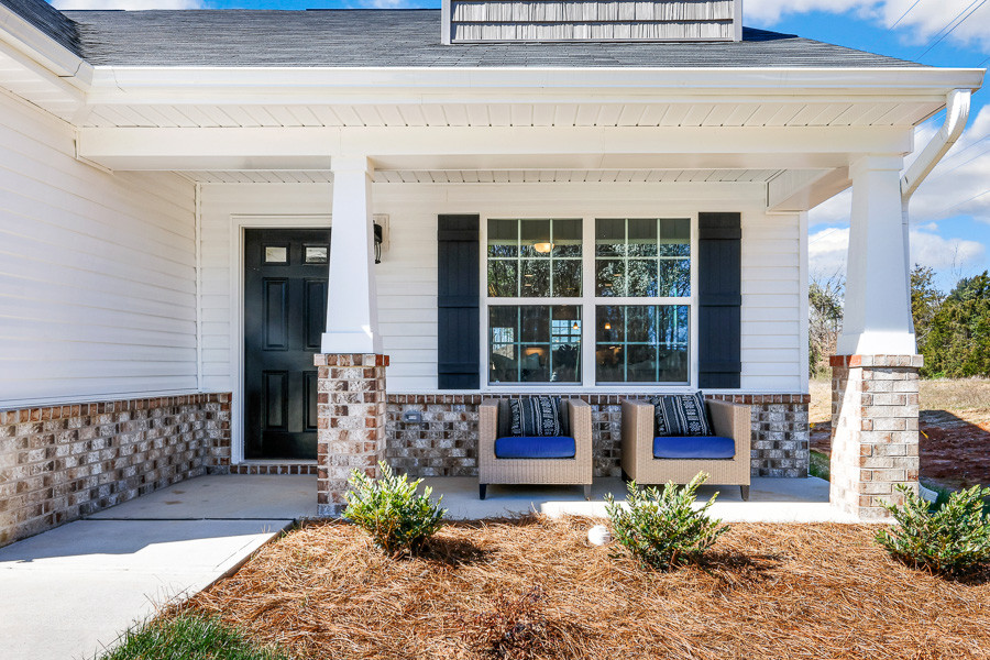 https://assets.windsorhomes.us/img/Indiana_A_VSC_lot1_4003_Straw_Hat_rd_exterior_close_front_porch.jpg