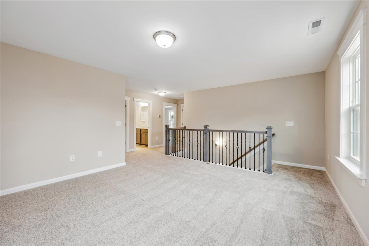 https://assets.windsorhomes.us/img/KL_Lot95_Bailey_elvF_1360_Reading_Ct_loft.jpg