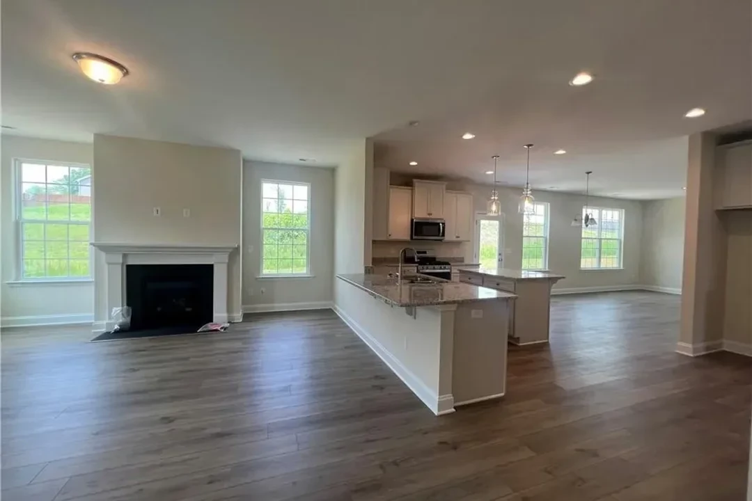 https://assets.windsorhomes.us/img/Lewisville_F_LS_lot201_216_Mimosa_Drive_Great_Room.webp
