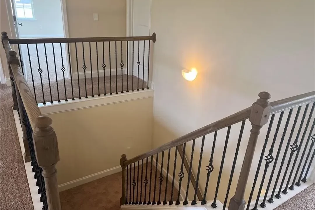 https://assets.windsorhomes.us/img/Lewisville_F_LS_lot201_216_Mimosa_Drive_Stairs.webp