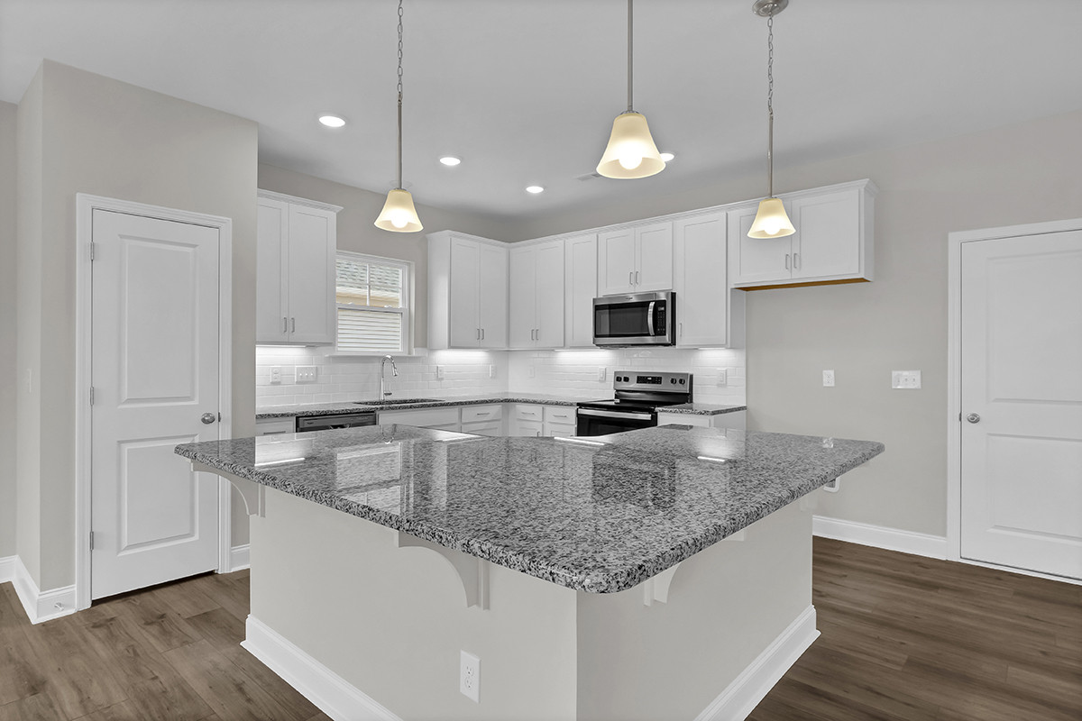https://assets.windsorhomes.us/img/MBW_lot59_Southport_809_Red_Sky_Drive_kitchen_2.JPG