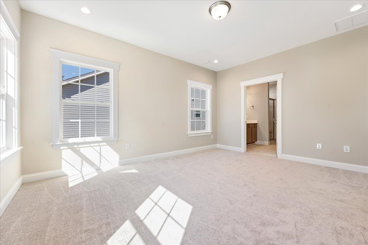 https://assets.windsorhomes.us/img/MVG_lot15_Pinehurst_3_elvA_1975_Meadowview_Drive_primary_suite.jpg