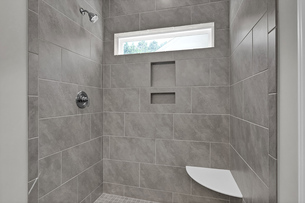 https://assets.windsorhomes.us/img/RR_lot61_Columbia_elvA_349_Eden_Drive_SW_primary_bath_shower.JPG