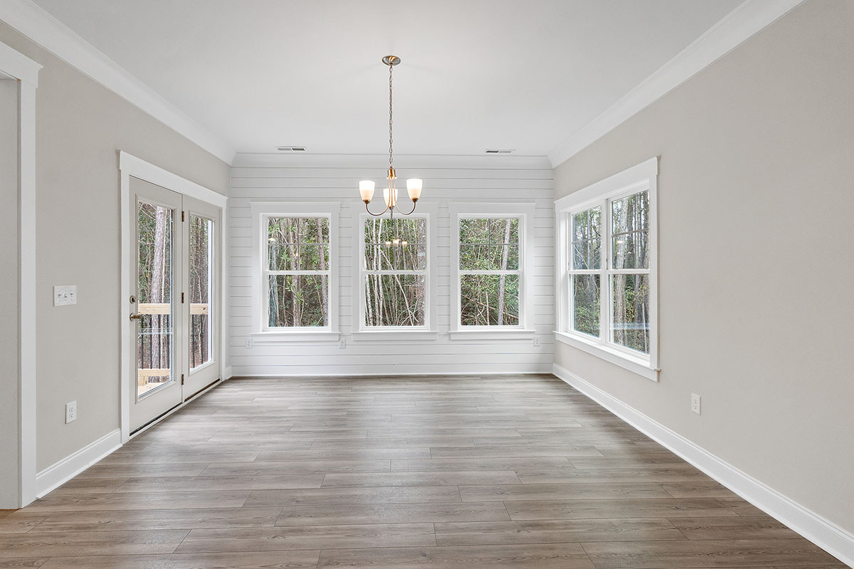 https://assets.windsorhomes.us/img/SH_lot631_Pinehurst_elvC_804_sweetgrass_St_sun_room.jpg