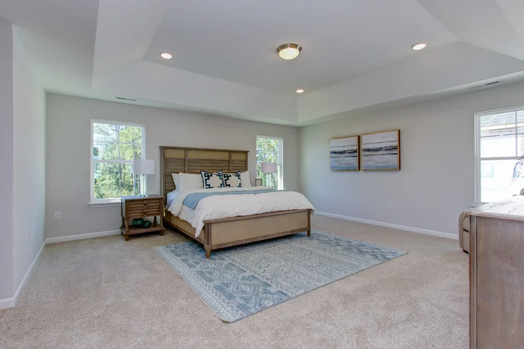 https://assets.windsorhomes.us/img/Seagrove_E_GRY2_lot2_9064_Gardens_Grove_Primary_Bedroom.webp