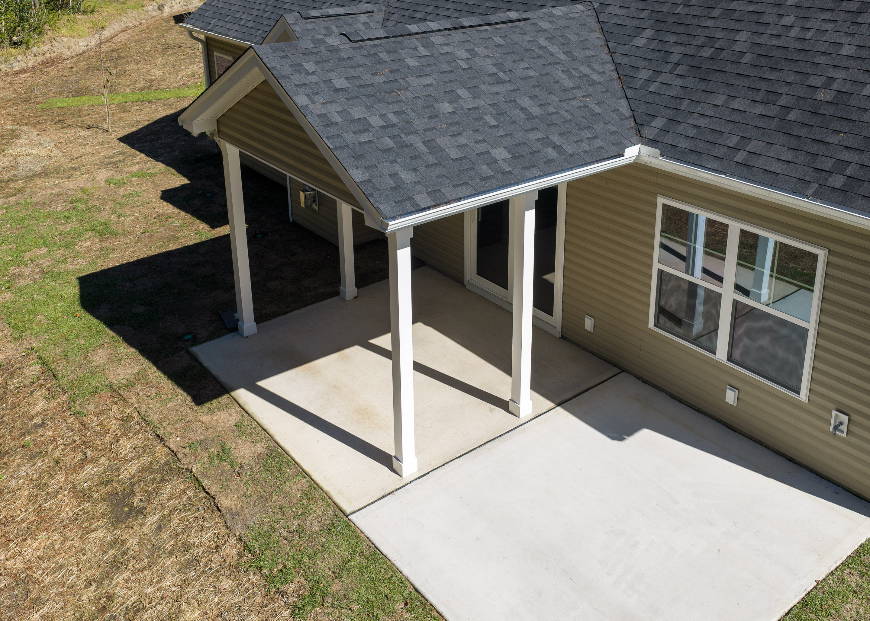 https://assets.windsorhomes.us/img/TT_lot73_Midland_elvD_171_Portico_Ct_Exterior_Back_Patio.jpg