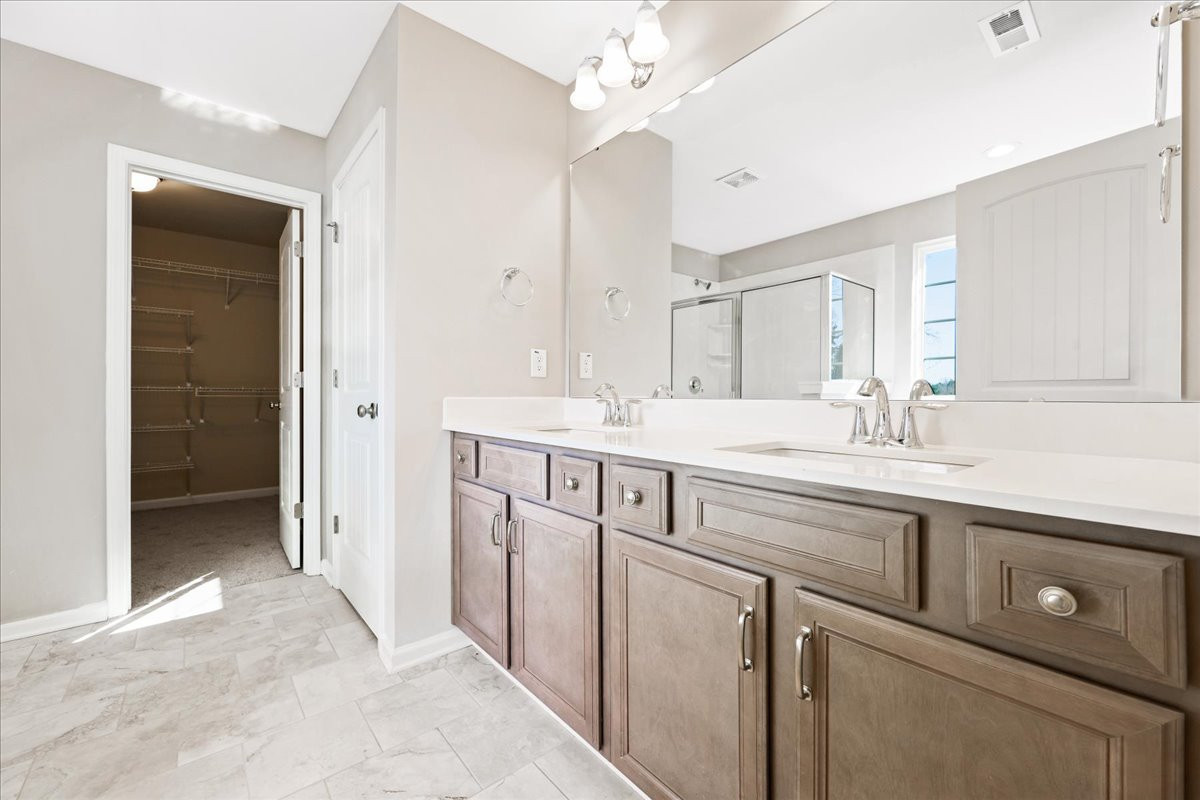 https://assets.windsorhomes.us/img/VR_lot74_Cameron_elvC_212_Wildwood_Lane_primary_bath.jpg
