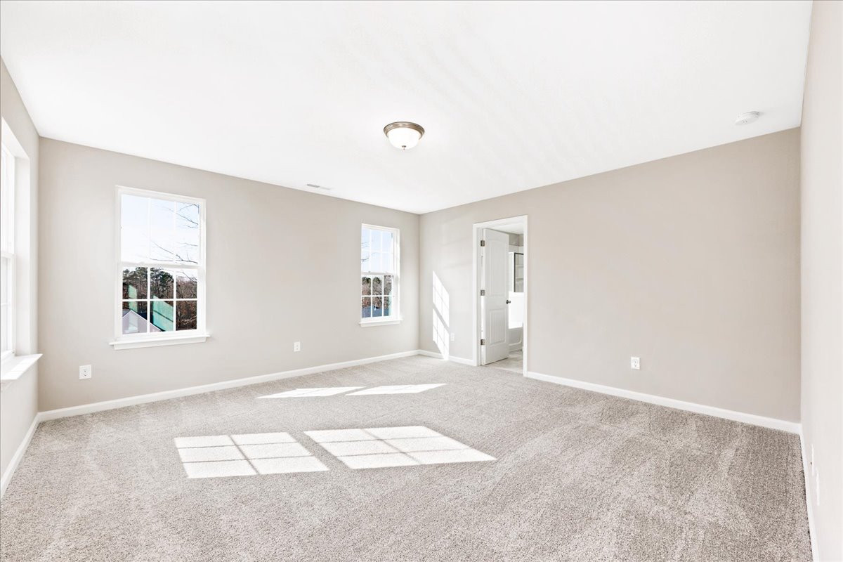 https://assets.windsorhomes.us/img/VR_lot74_Cameron_elvC_212_Wildwood_Lane_primary_suite.jpg