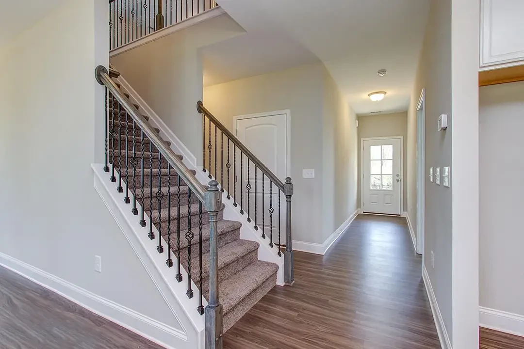 https://assets.windsorhomes.us/img/cameron_a_LC56_325_harbour_view_drive_stairs.webp